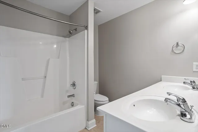a view of storage and utility room with washer and dryer