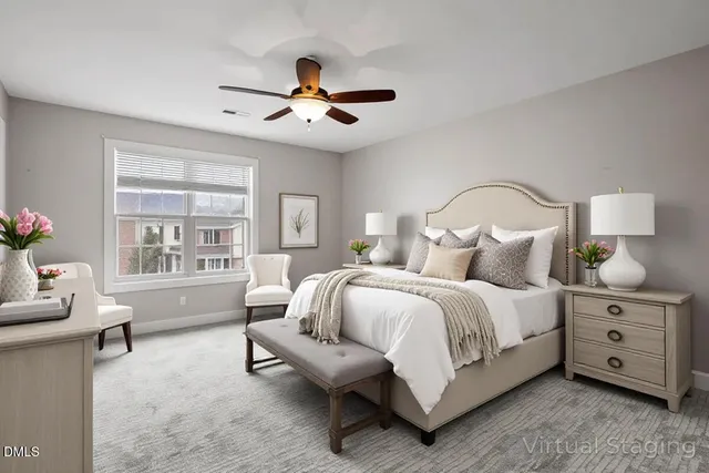 a spacious bedroom with a bed and a chandelier