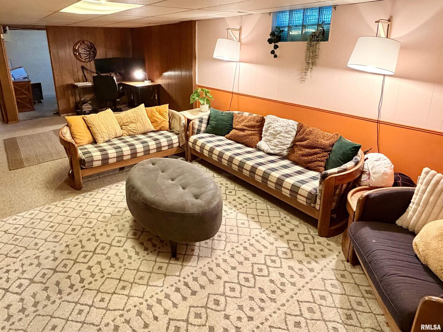 1043 14th Avenue South Clinton, IA 52732 - Photo 19 of 23 a living room with furniture and a rug