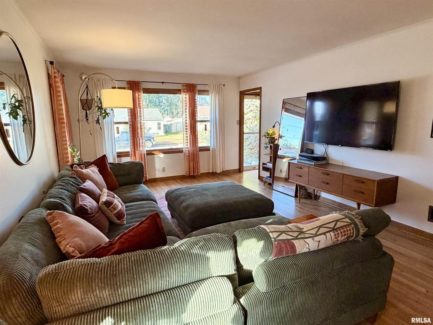 1043 14th Avenue South Clinton, IA 52732 - Photo 5 of 23 a living room with furniture and a flat screen tv