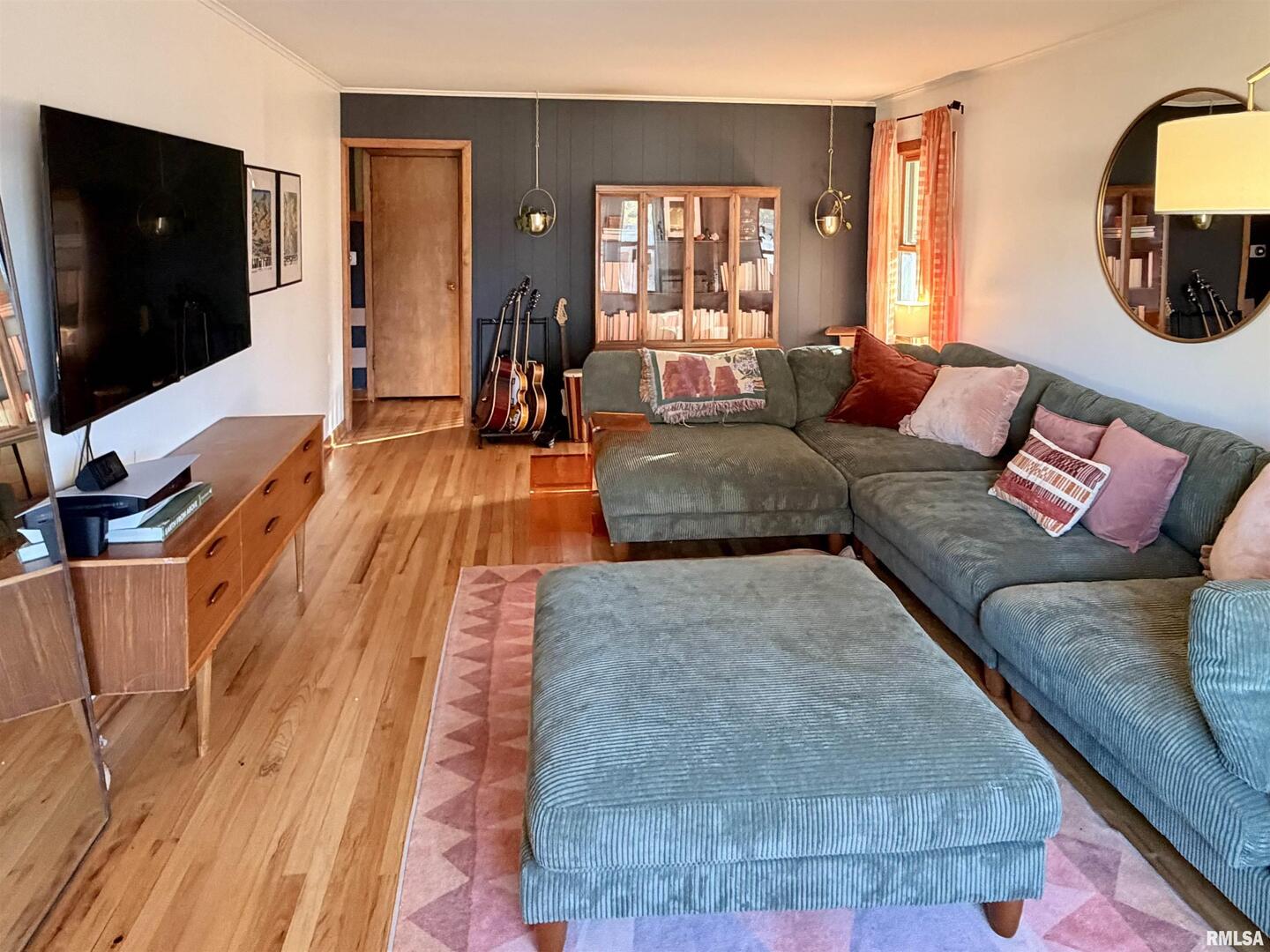 1043 14th Avenue South Clinton, IA 52732 - Photo 8 of 23 a living room with furniture and a flat screen tv