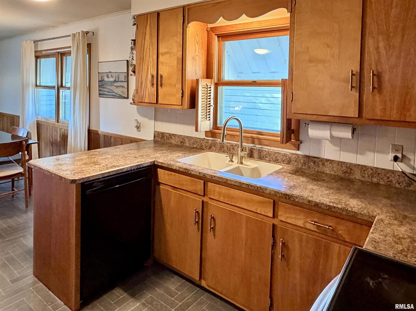 1043 14th Avenue South Clinton, IA 52732 - Photo 10 of 23 a kitchen with stainless steel appliances granite countertop a sink and a cabinets