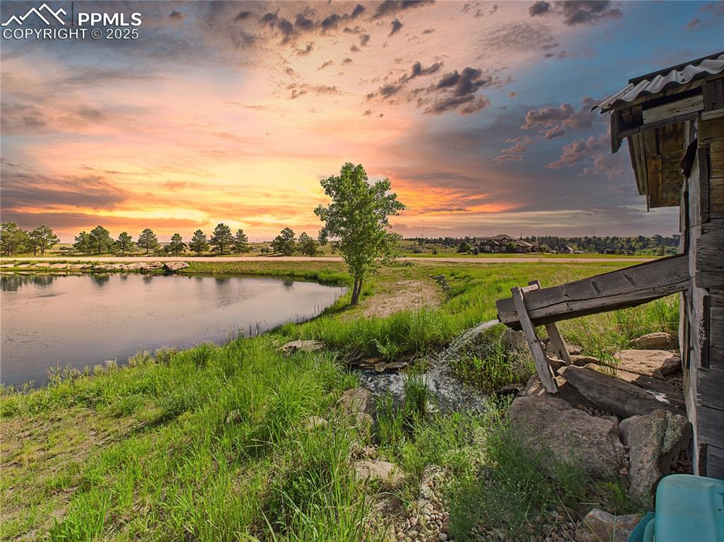 11834 Cave Spring Road Franktown, CO 80116 - Photo 41 of 50 a view of a lake with a big yard