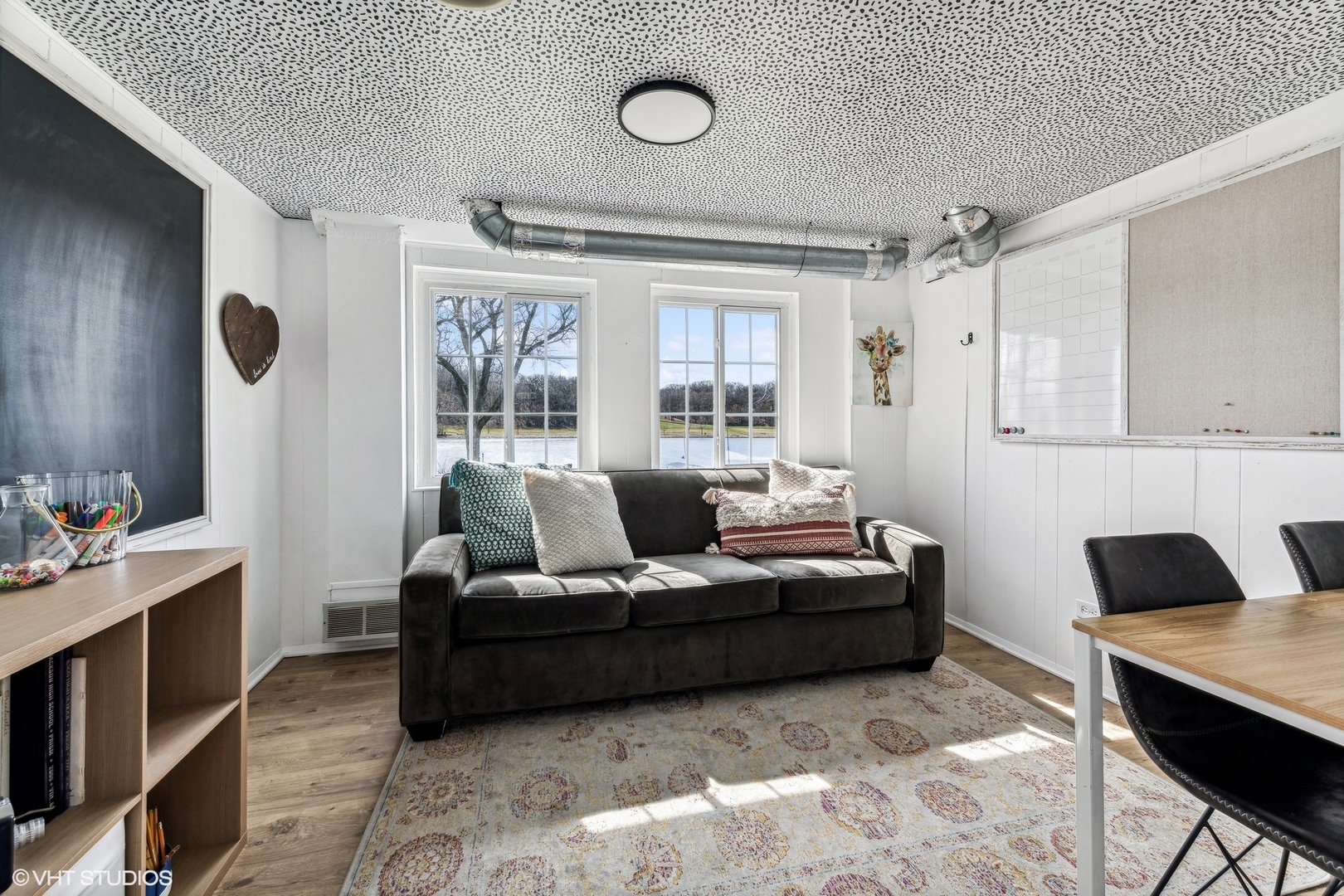 705 Spring Beach Way Cary, IL 60013 - Photo 24 of 47 a living room with furniture and a flat screen tv