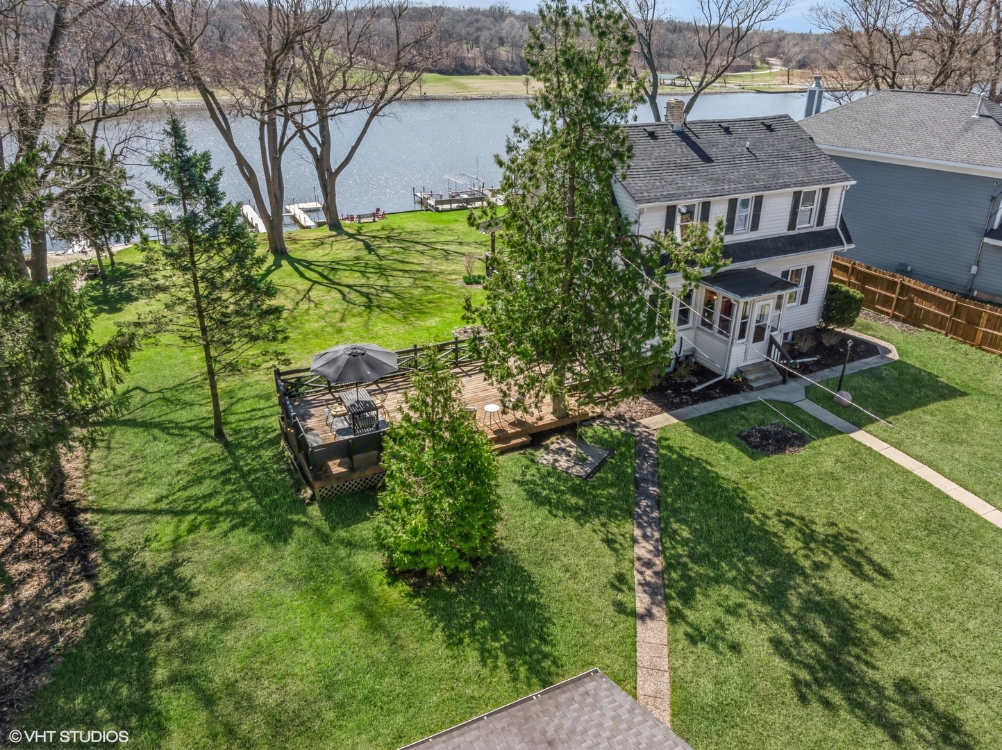 705 Spring Beach Way Cary, IL 60013 - Photo 29 of 47 a backyard of a house with table and chairs