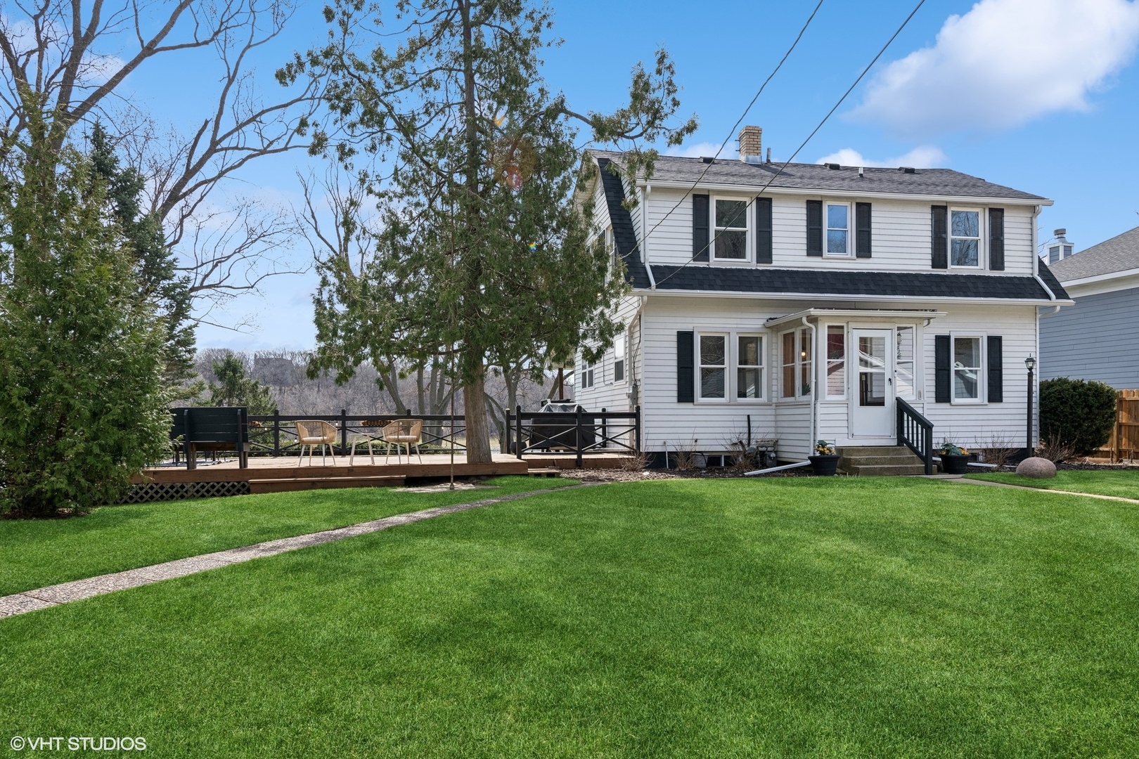 705 Spring Beach Way Cary, IL 60013 - Photo 3 of 47 a front view of a house with a garden