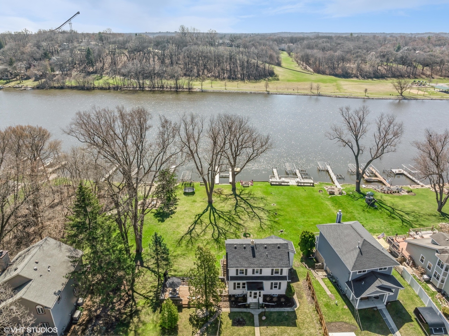 705 Spring Beach Way Cary, IL 60013 - Photo 32 of 47 a view of a lake with a mountain view