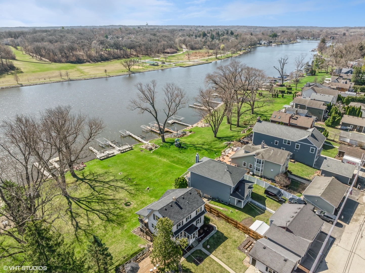 705 Spring Beach Way Cary, IL 60013 - Photo 33 of 47 a view of a lake with a yard and lake view