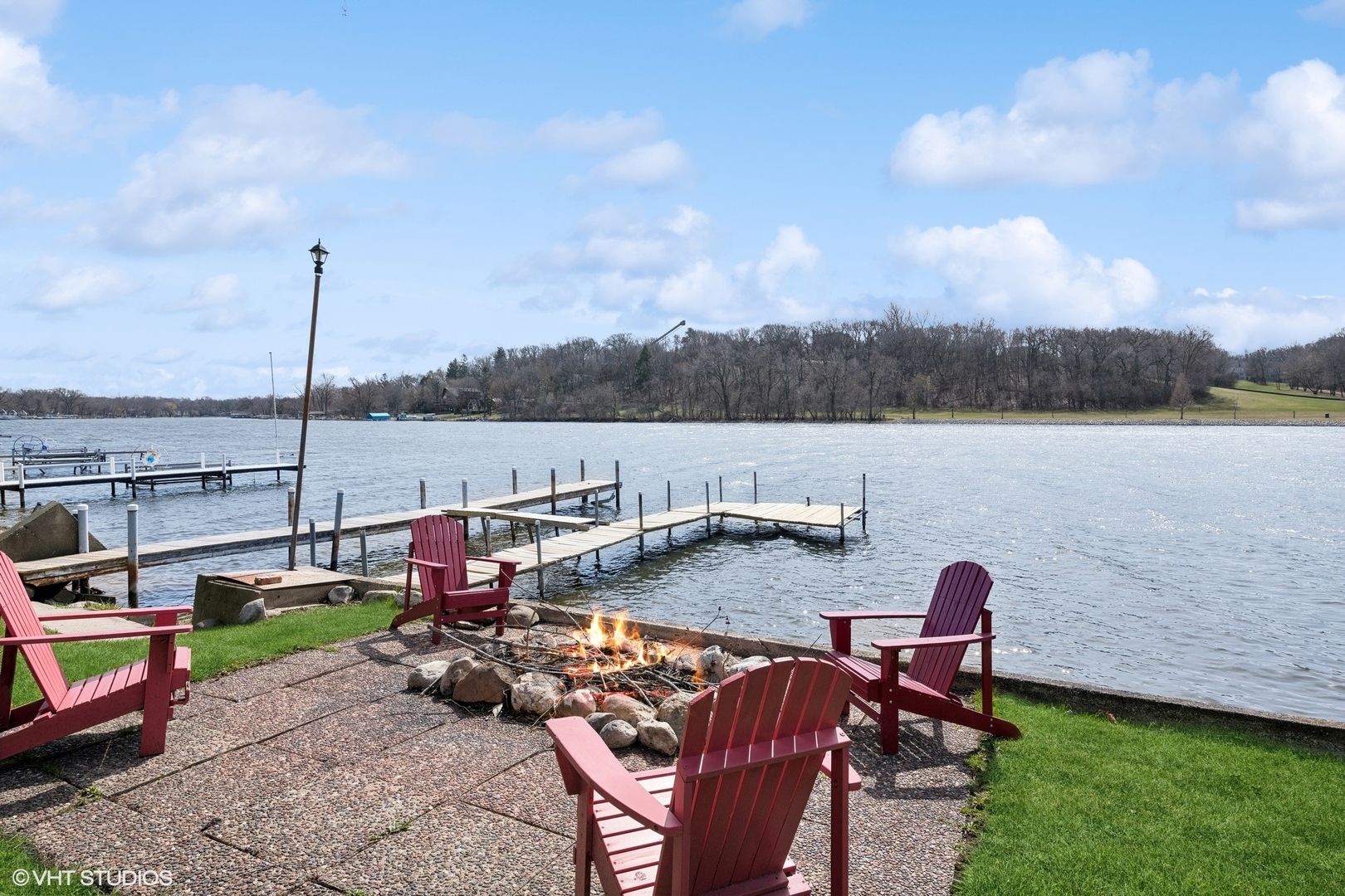 705 Spring Beach Way Cary, IL 60013 - Photo 38 of 47 a view of a lake with lawn chairs