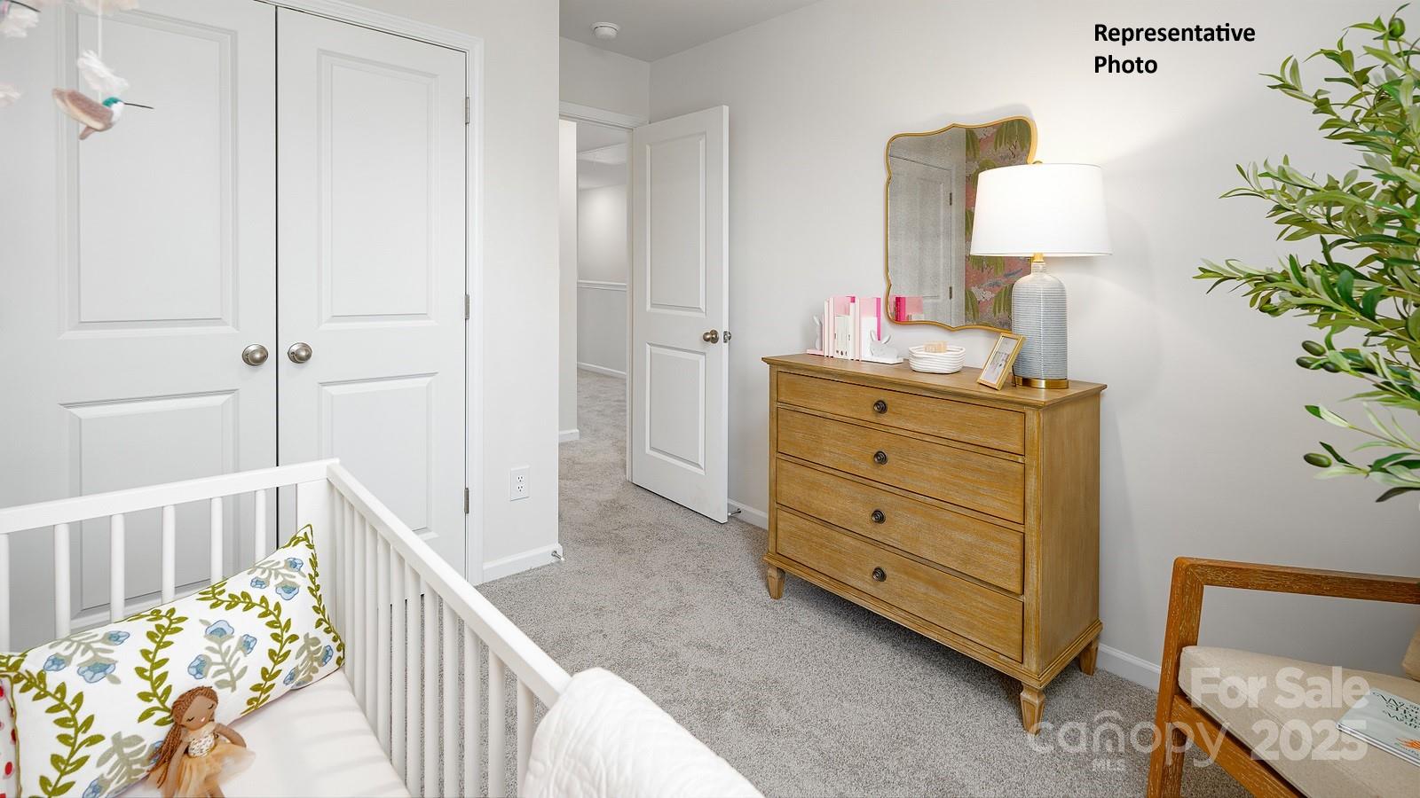 1314 Equestrian Lane York, SC 29745 - Photo 19 of 25 a bedroom with a bed and a lamp on dresser