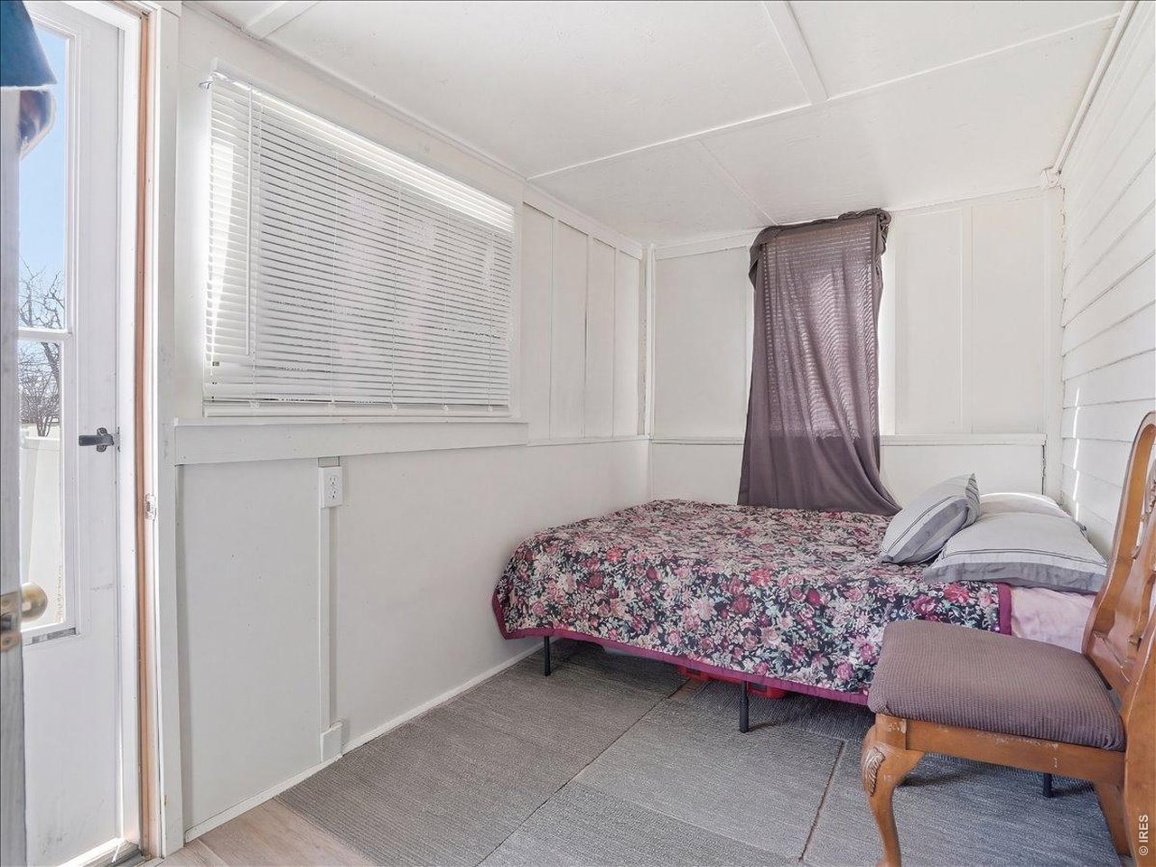228 13th Street Greeley, CO 80631 - Photo 14 of 29 a bedroom with a bed and a window
