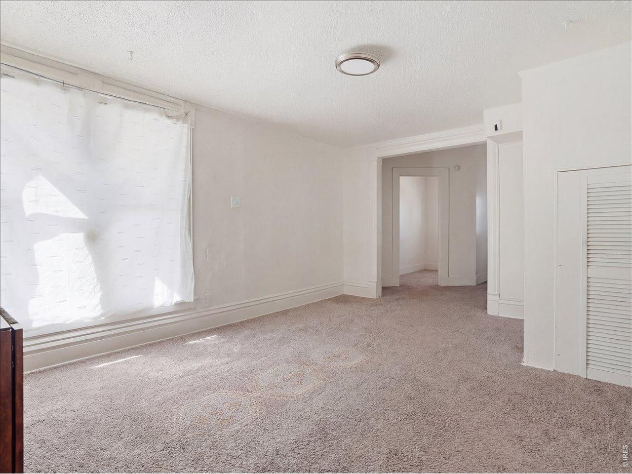 228 13th Street Greeley, CO 80631 - Photo 15 of 29 a view of an empty room with a window