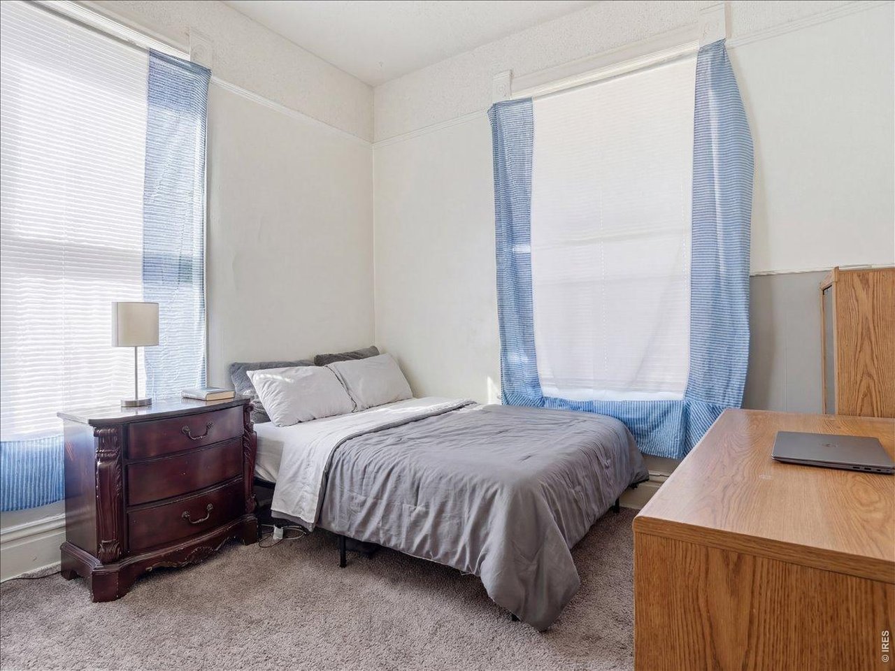 228 13th Street Greeley, CO 80631 - Photo 17 of 29 a bedroom with a bed and a window
