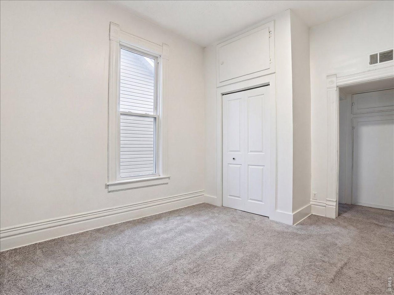 228 13th Street Greeley, CO 80631 - Photo 19 of 29 an empty room with a window