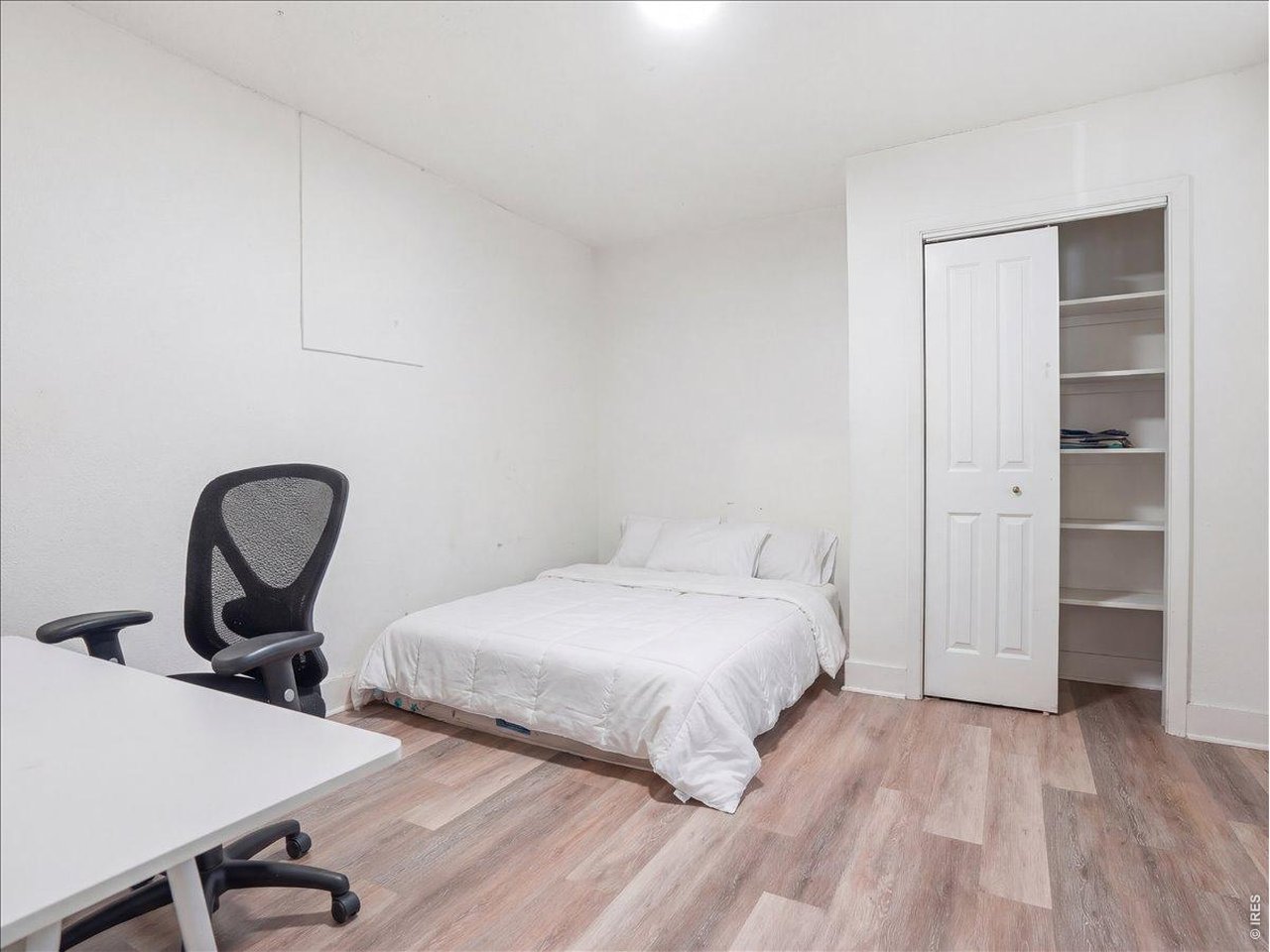 228 13th Street Greeley, CO 80631 - Photo 20 of 29 a bedroom with a bed and a desk
