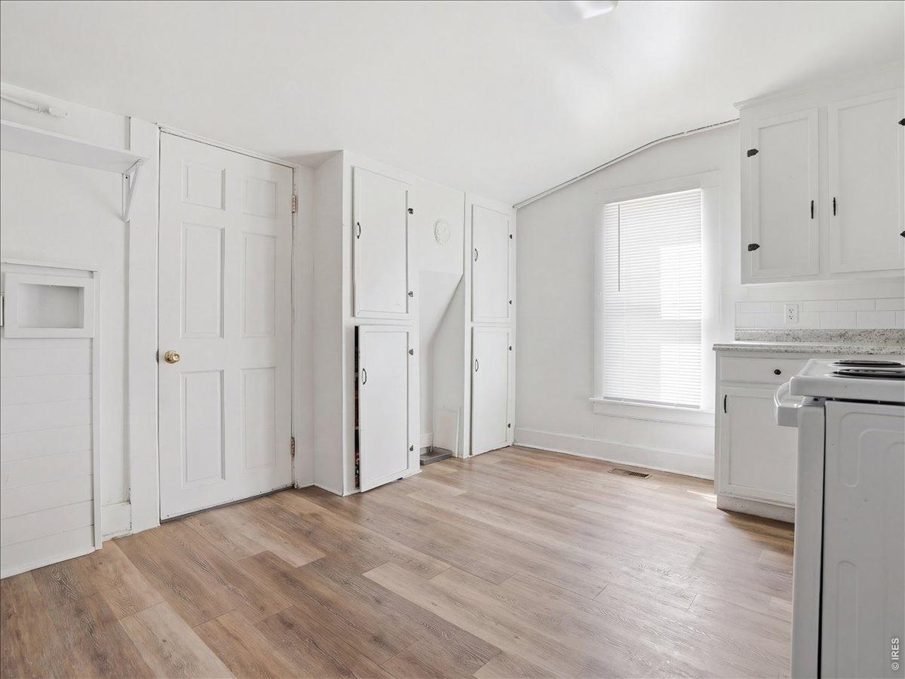 228 13th Street Greeley, CO 80631 - Photo 27 of 29 a view of a kitchen with a sink and a refrigerator