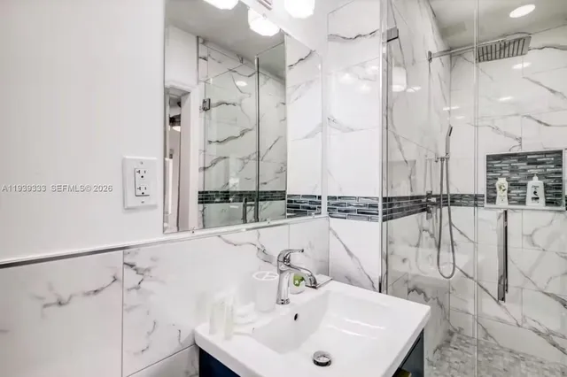 a bathroom with a bathtub and a sink