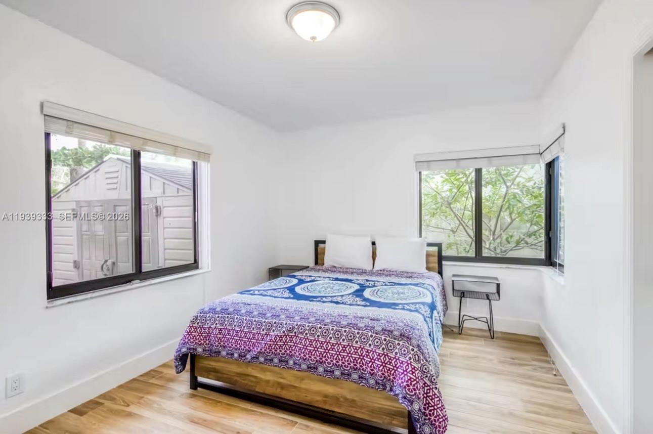 2639 Monroe Street Hollywood, FL 33020 - Photo 16 of 27 a bedroom with a bed and a large window