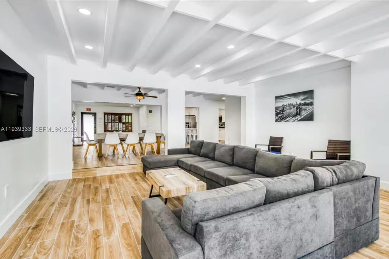 2639 Monroe Street Hollywood, FL 33020 - Photo 17 of 27 a living room with furniture and a flat screen tv