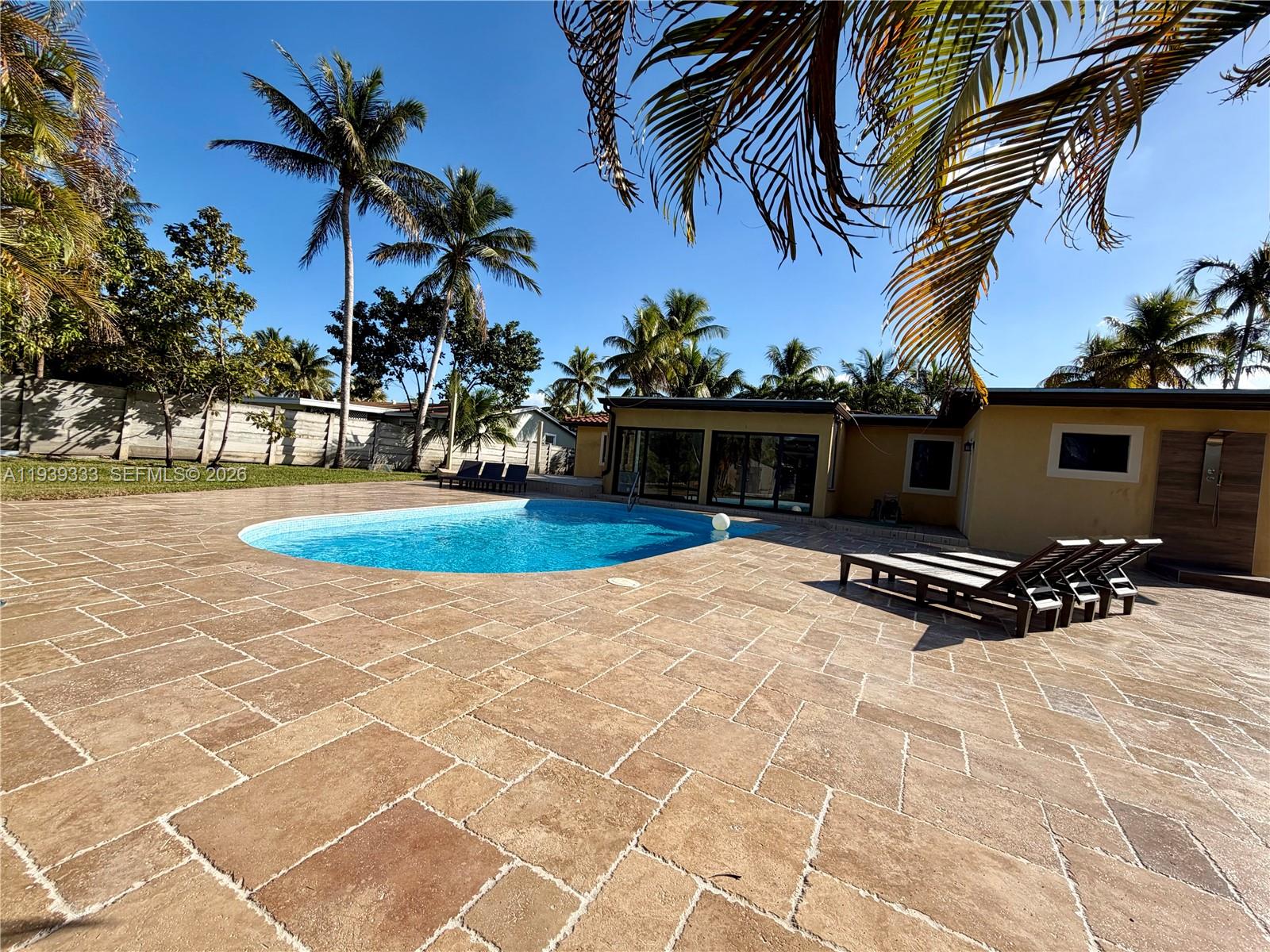 2639 Monroe Street Hollywood, FL 33020 - Photo 22 of 27 a view of a backyard with a patio