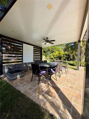 a view of a patio with a table and chairs in patio