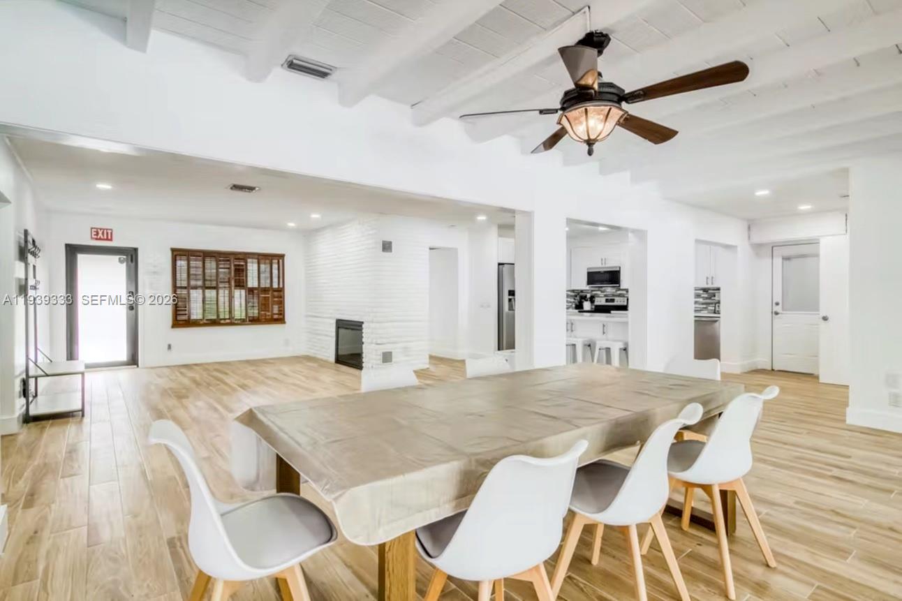 2639 Monroe Street Hollywood, FL 33020 - Photo 3 of 27 a view of a dining room with furniture and wooden floor