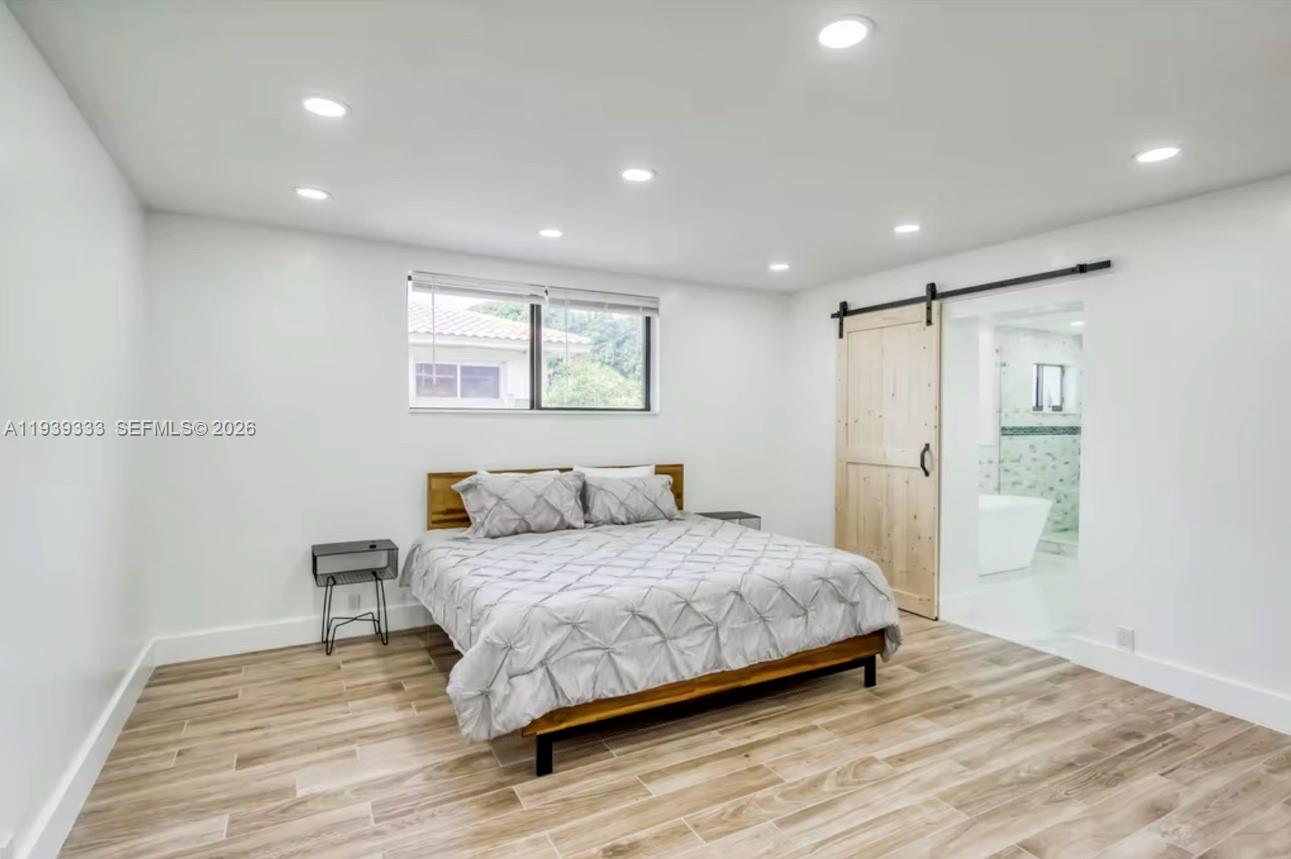 2639 Monroe Street Hollywood, FL 33020 - Photo 10 of 27 a bedroom with a bed and a painting