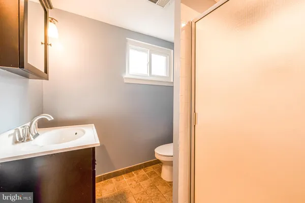 a bathroom with a sink and a toilet