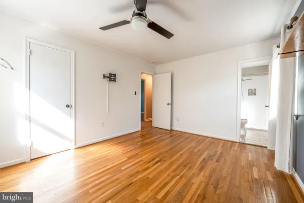 a view of an empty room and wooden floor