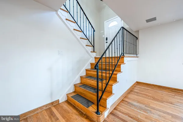 a view of entryway with wooden floor
