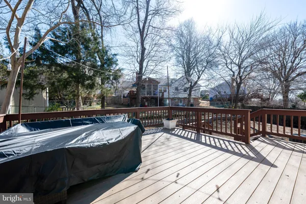 a view of balcony with wooden floor and outdoor seating