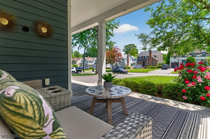 921 Harding Street Westfield, NJ 07090 - Photo 6 of 50 a view of a patio with a table chairs and a backyard