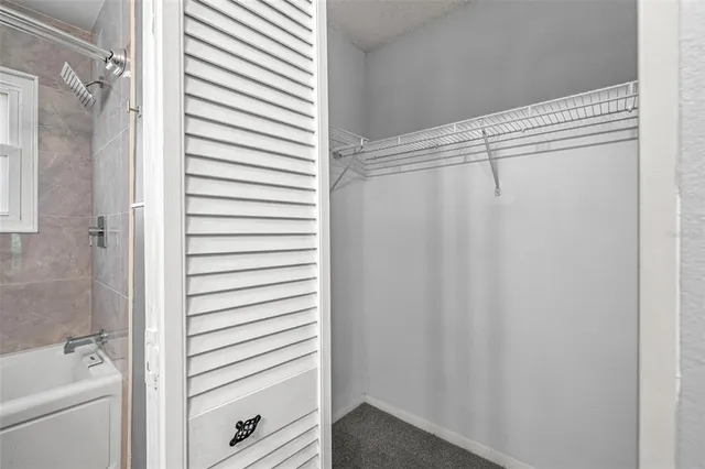 a bathroom with a shower curtain and a sink