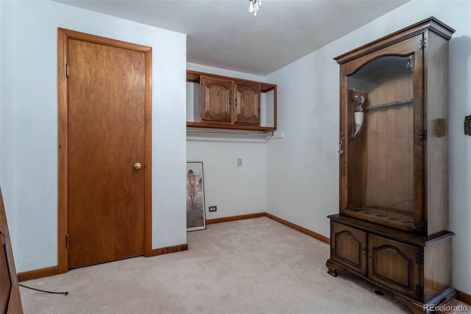 3075 South Emerson Way Englewood, CO 80113 - Photo 15 of 28 an empty room with mirror and windows