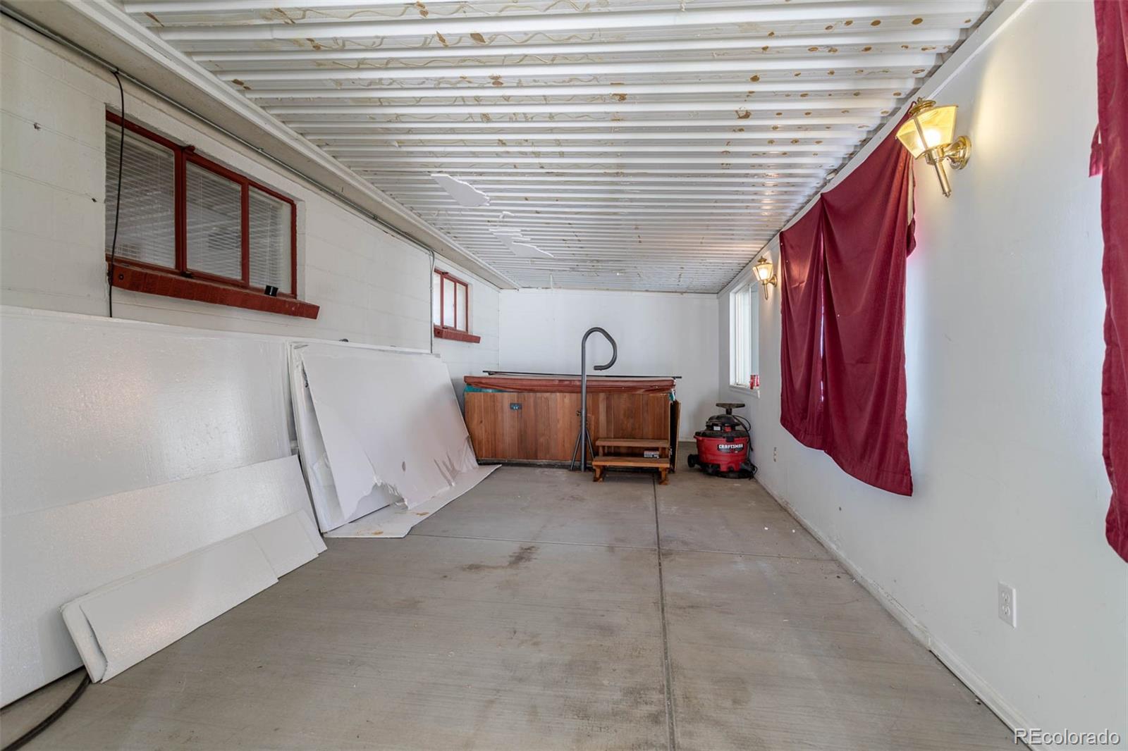 3075 South Emerson Way Englewood, CO 80113 - Photo 17 of 28 a view of a hallway with stairs and furniture