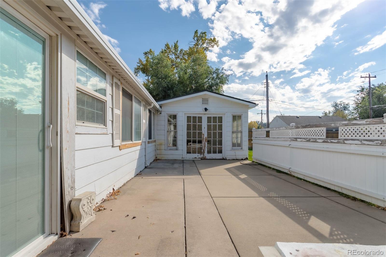 3075 South Emerson Way Englewood, CO 80113 - Photo 19 of 28 a view of a house with a yard