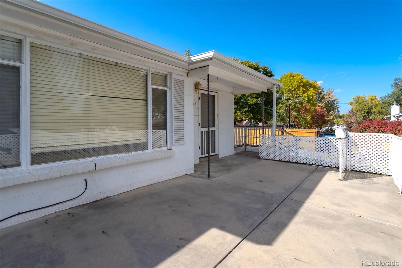 3075 South Emerson Way Englewood, CO 80113 - Photo 3 of 28 a view of a house with a outdoor space