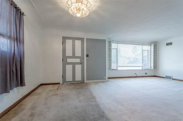 an empty room with windows