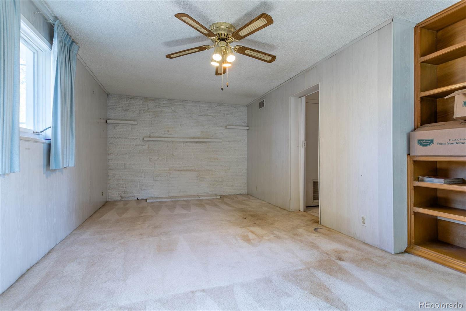 3075 South Emerson Way Englewood, CO 80113 - Photo 9 of 28 an empty room with closet and a window