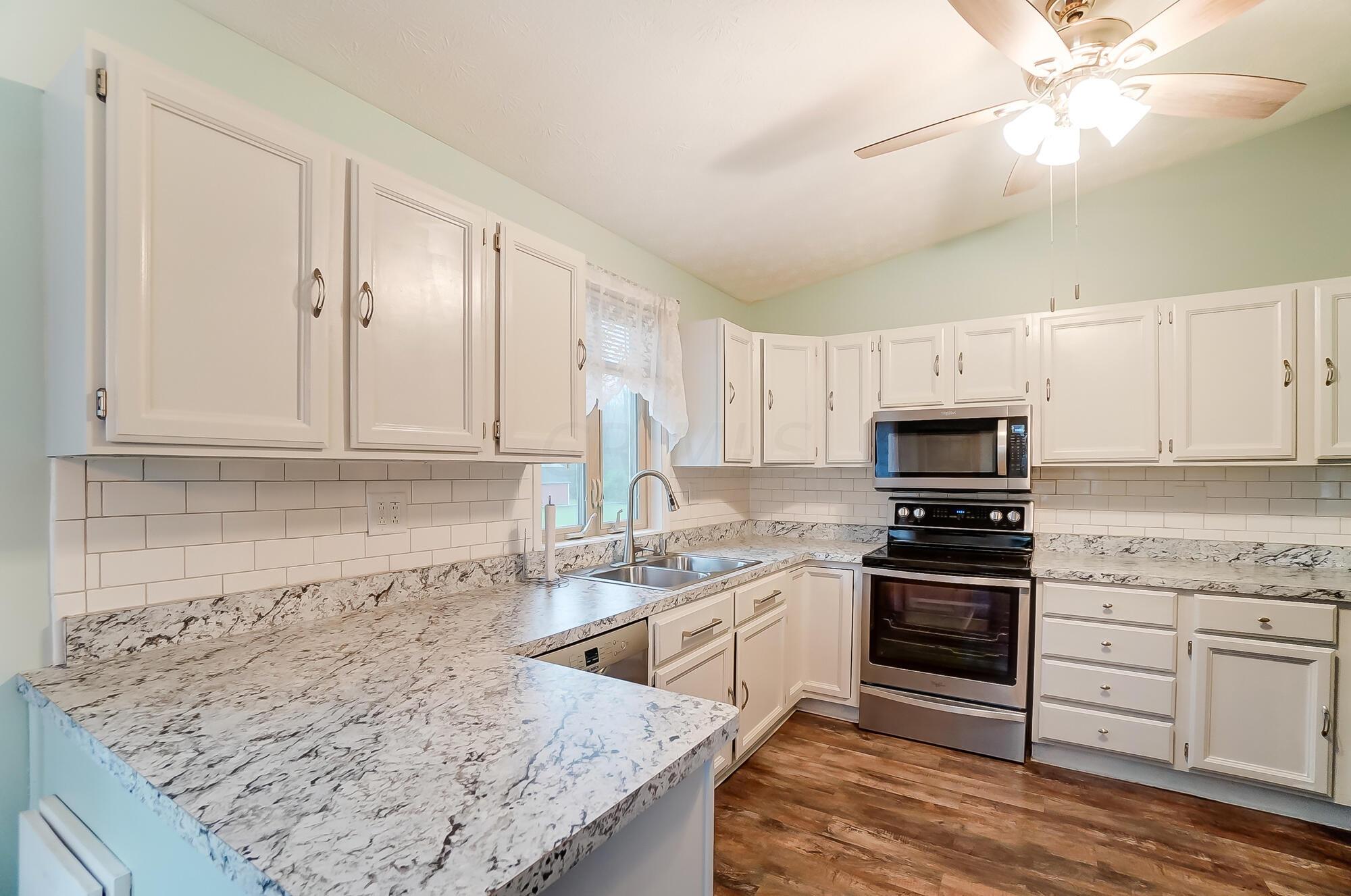 6964 Taylor Road Southwest Reynoldsburg, OH 43068 - Photo 15 of 42 Taylor Rd SW Kitchen from End Island