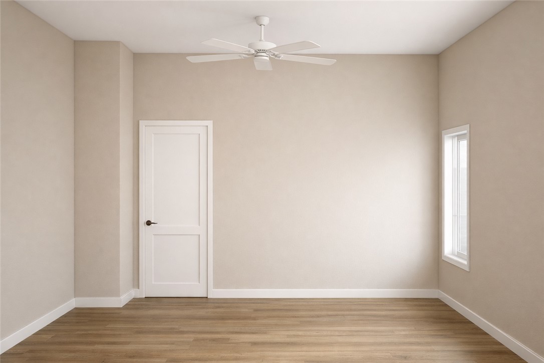 2572 Shady Rte Lane Bryan, TX 77803 - Photo 12 of 17 an empty room with wooden floor and fan