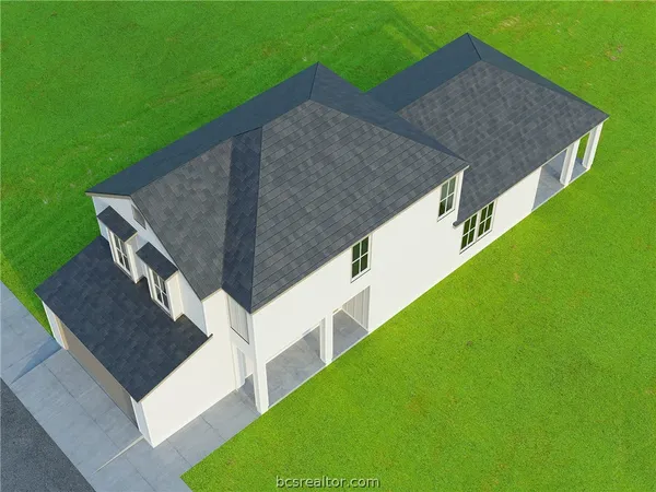 a aerial view of a house with a yard