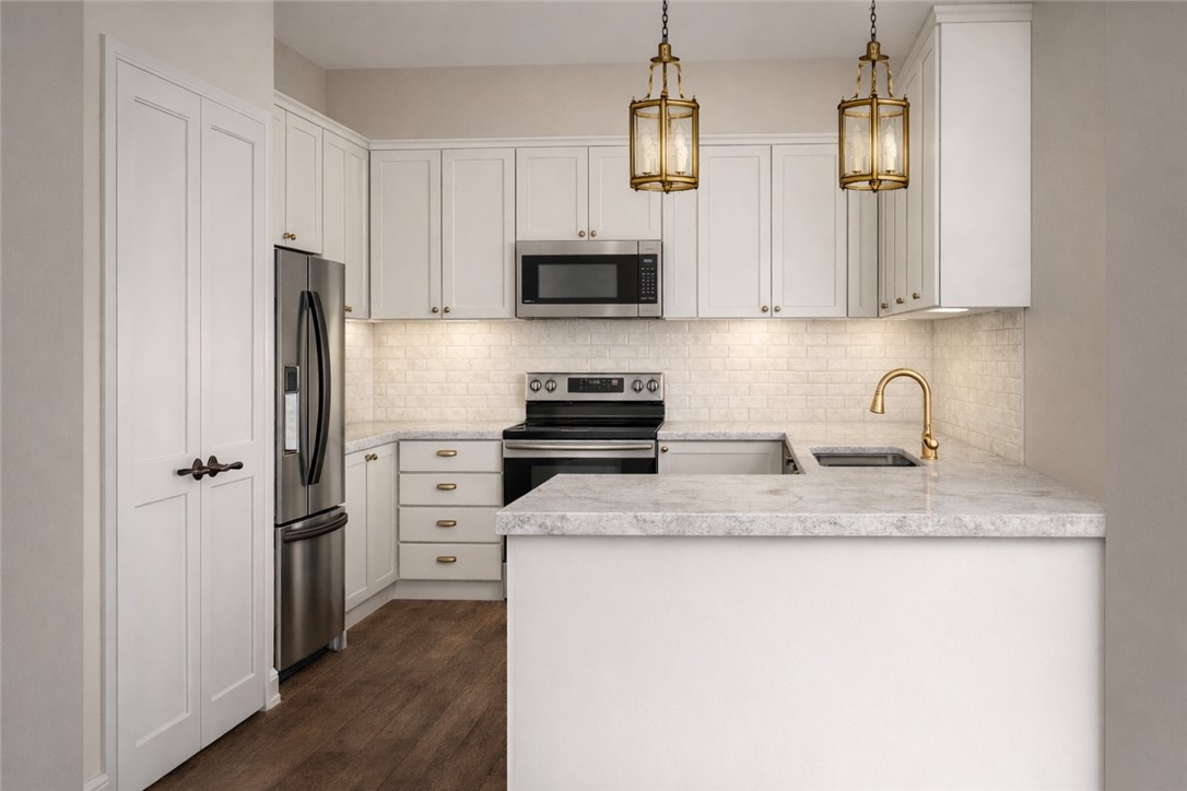 2572 Shady Rte Lane Bryan, TX 77803 - Photo 5 of 17 a kitchen with stainless steel appliances granite countertop a refrigerator a stove a sink and white cabinets