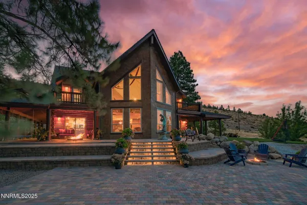 a outdoor space with the couches and dining table with the garden view