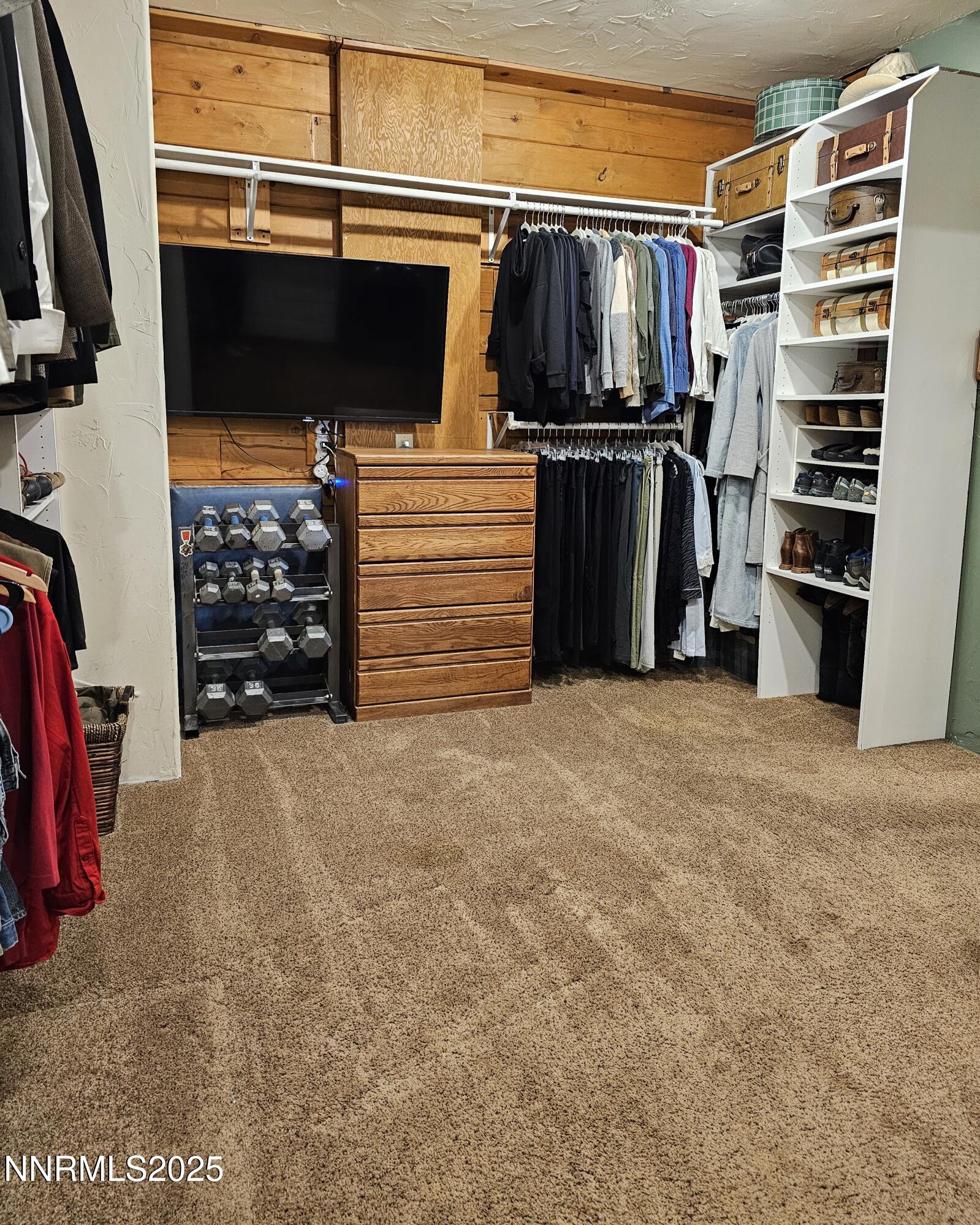 16700 Mt Rose Highway Reno, NV 89511 - Photo 30 of 50 a view of walk in closet with clothes and shoes