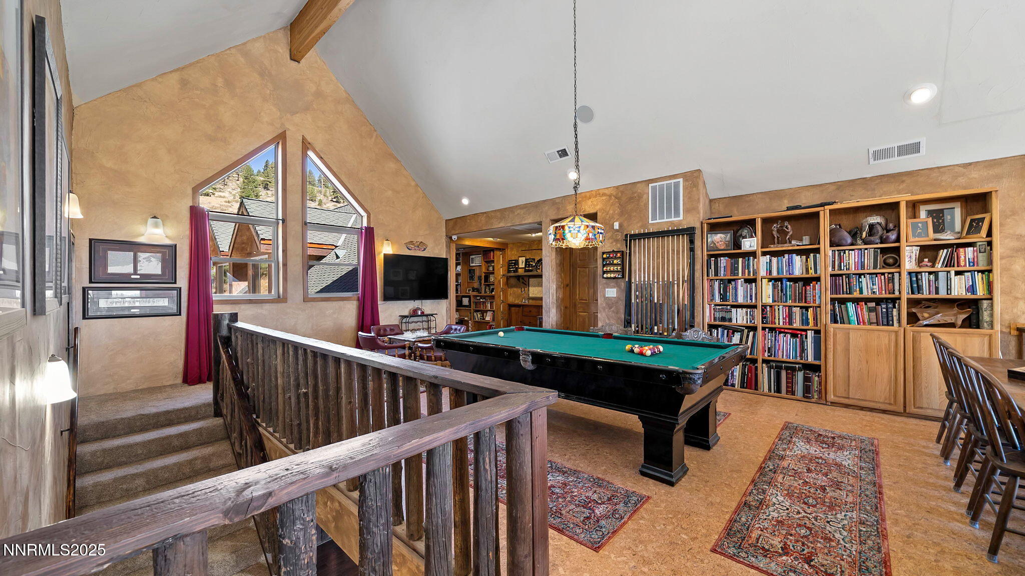 16700 Mt Rose Highway Reno, NV 89511 - Photo 37 of 50 a living room with furniture and a book shelf