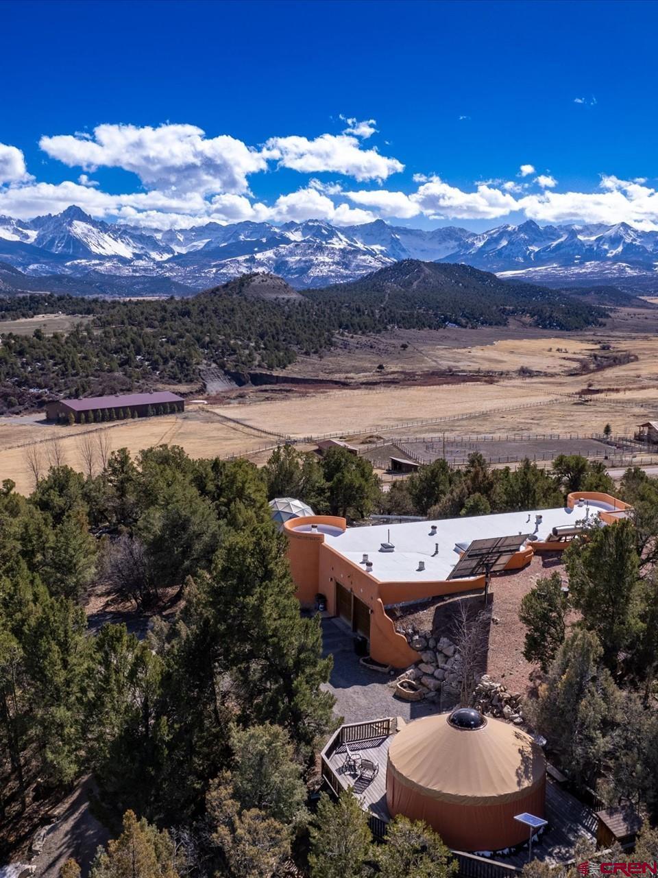 a view of a terrace with a table and chairs