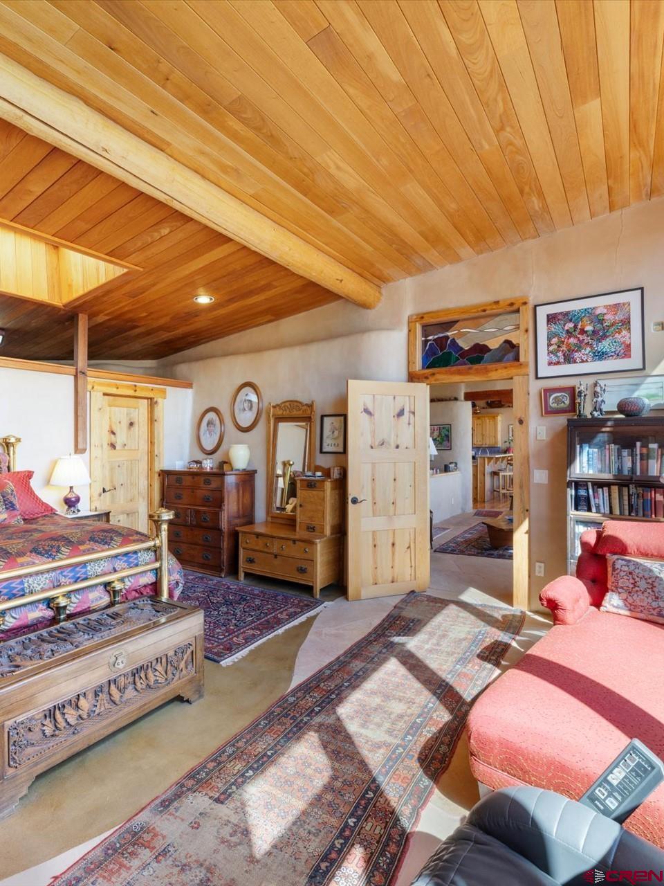 1137 Pleasant Point Drive Ridgway, CO 81432 - Photo 23 of 34 a bed room with furniture and a rug