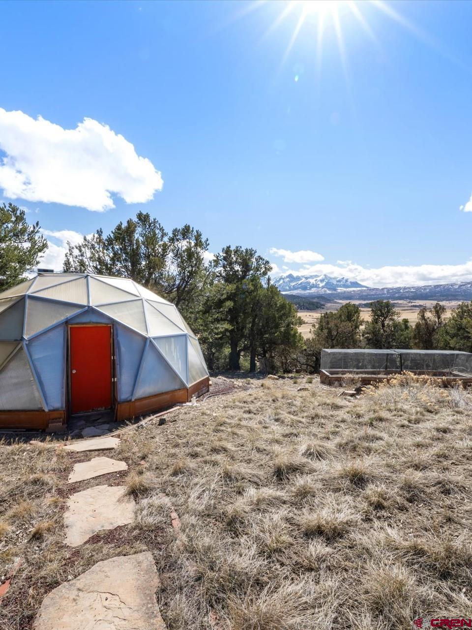1137 Pleasant Point Drive Ridgway, CO 81432 - Photo 27 of 34 a view of a lake with a mountain