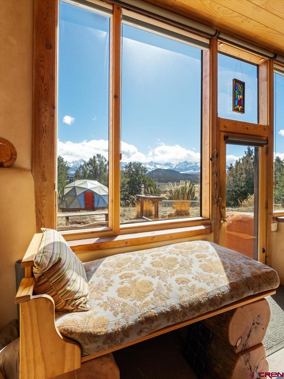 1137 Pleasant Point Drive Ridgway, CO 81432 - Photo 6 of 34 a bed sitting in a bedroom next to a window